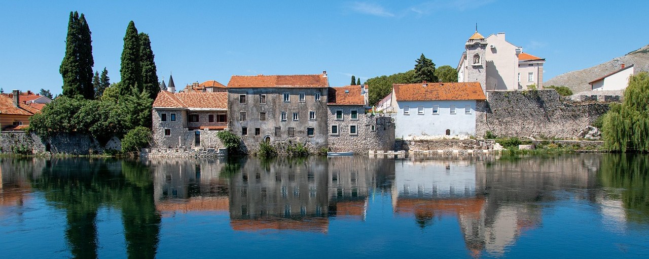 Trebinje’s old riverside buildings reflected in the Trebišnjica River, Bosnia and Herzegovina.