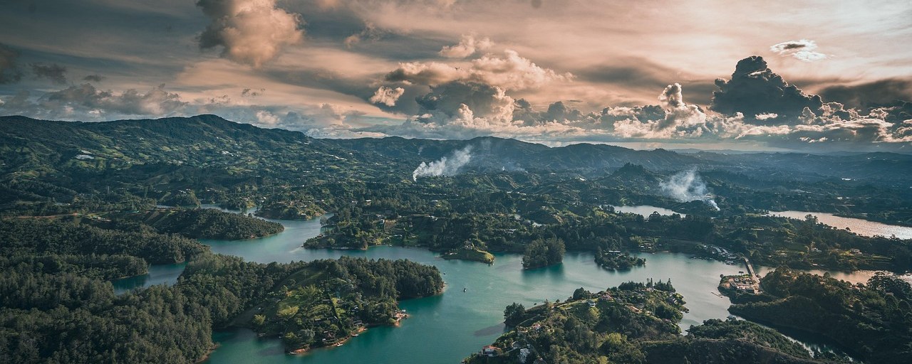 Guatapé reservoir and wooded islands at sunset in Colombia.