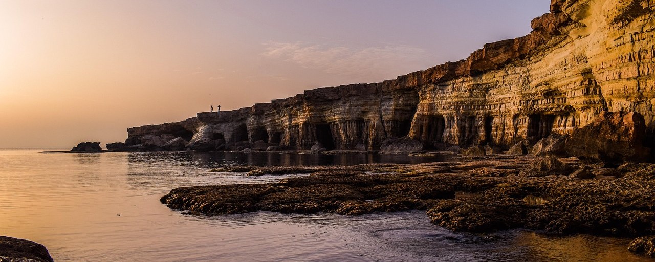 Cape Greco sea cliffs at sunset in Cyprus.