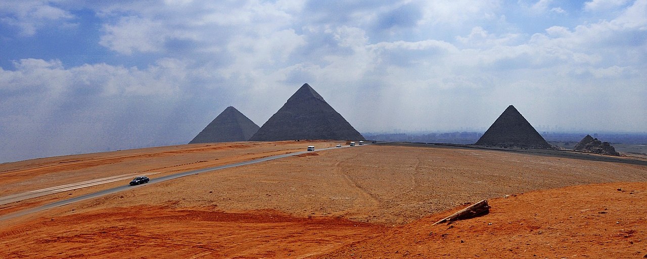 Pyramids of Giza across the desert plateau in Egypt