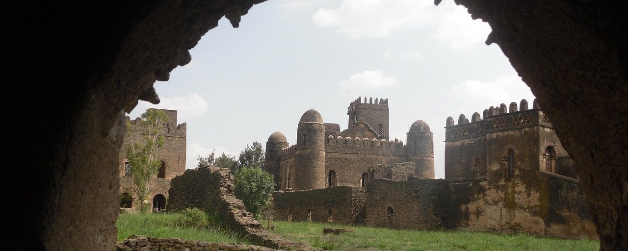 Gondar castle framed by a stone arch in Ethiopia