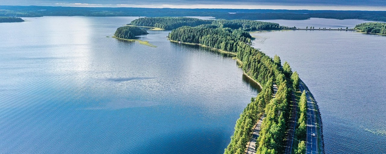 Forested Punkaharju ridge winding between lakes in Finland