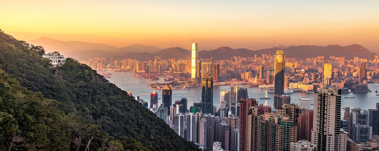 Victoria Harbour and the Hong Kong skyline at sunset