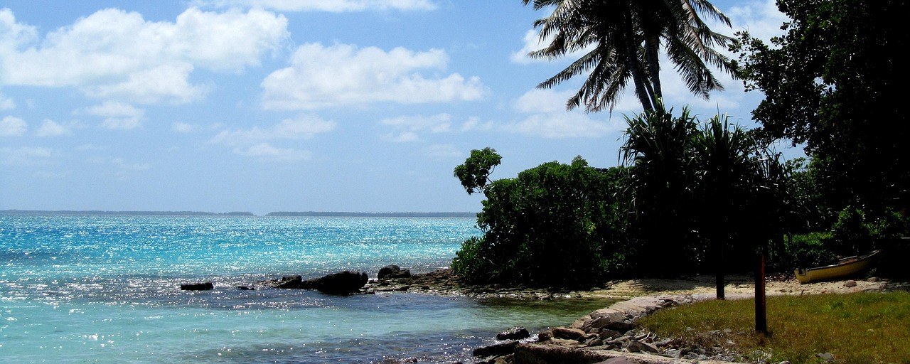 Palm-lined lagoon shore on Fanning Island, Kiribati
