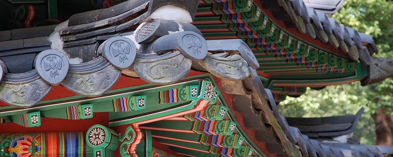 Decorated roof eaves at Changdeokgung Palace in Seoul, South Korea