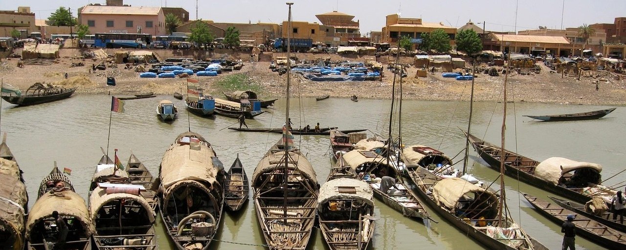 Traditional wooden boats at a river harbour in Mali