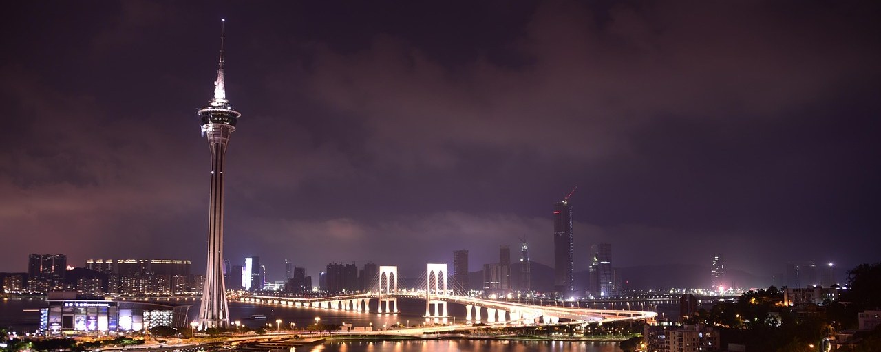 Macau Tower and illuminated waterfront at night, Macau