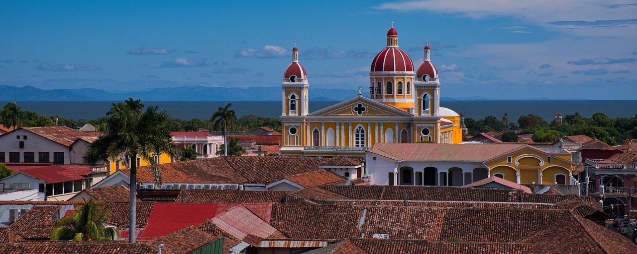 Granada Cathedral above tiled rooftops in Granada, Nicaragua