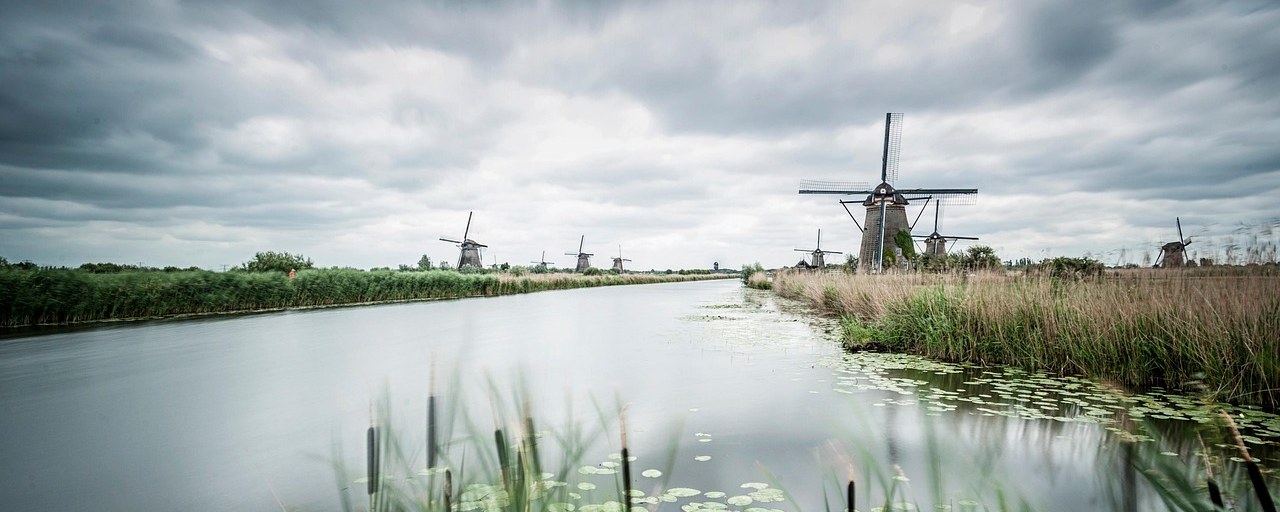 Kinderdijk windmills beside a canal in the Netherlands