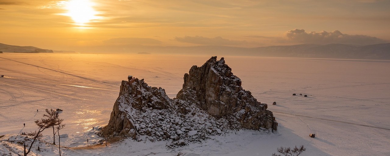 Snow-covered rocks beside frozen Lake Baikal, Russia