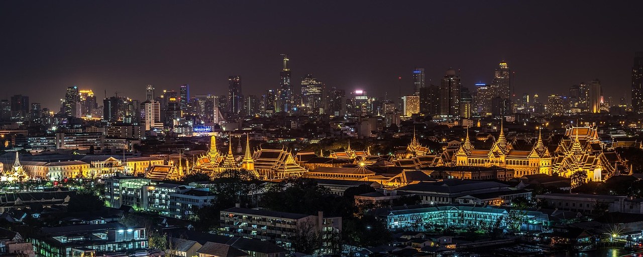 Grand Palace illuminated at night in Bangkok, Thailand