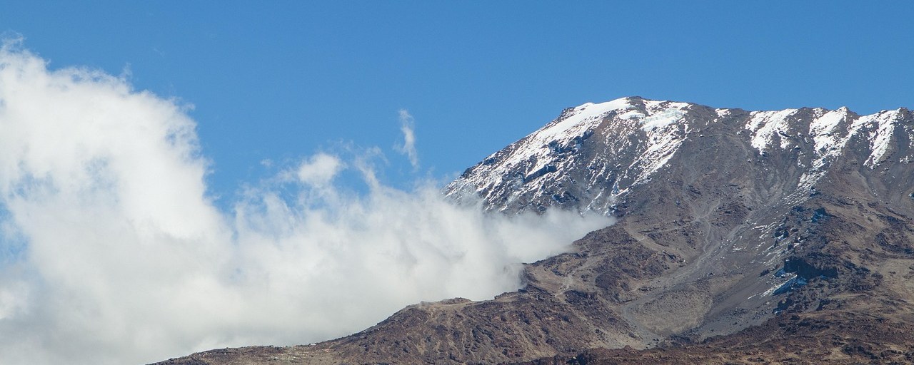 Mount Kilimanjaro rising above clouds in Tanzania