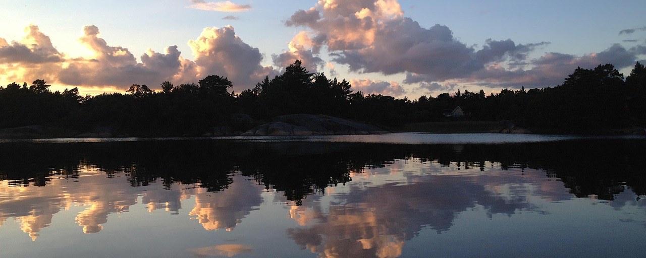 Clouds reflected in calm water in the Stockholm archipelago
